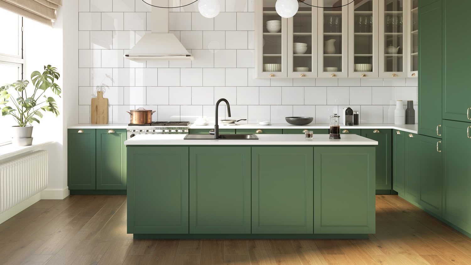 The interior of a kitchen with green cabinets and laminate flooring