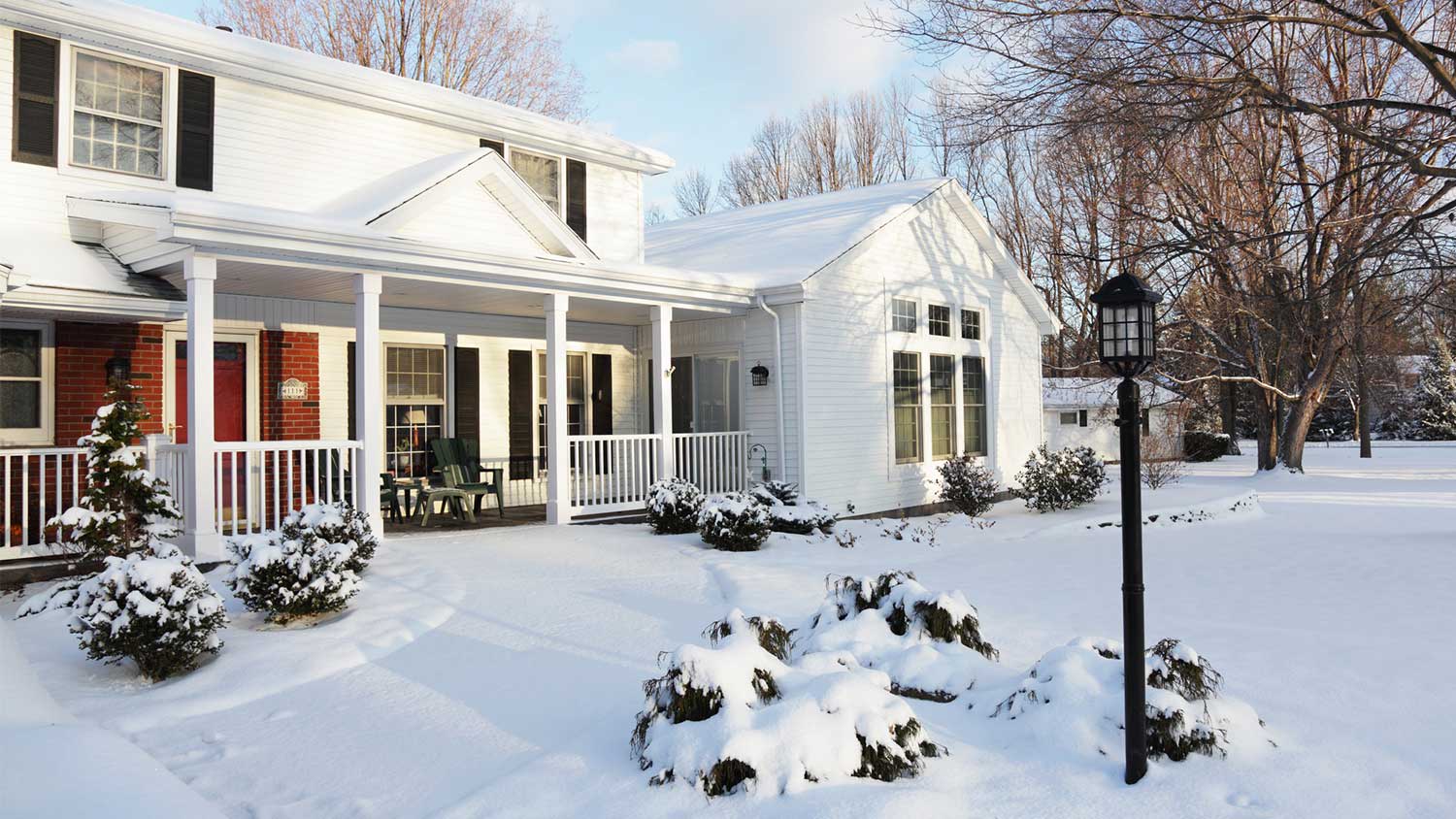 Suburban house exterior with snow