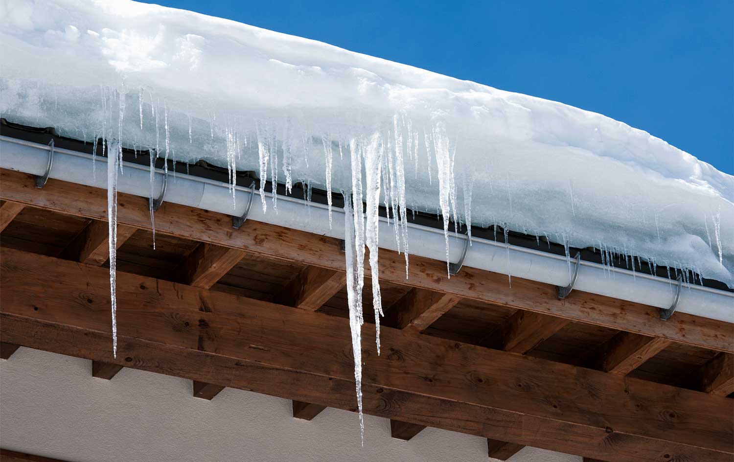 Close up of icicles hanging from the roof
