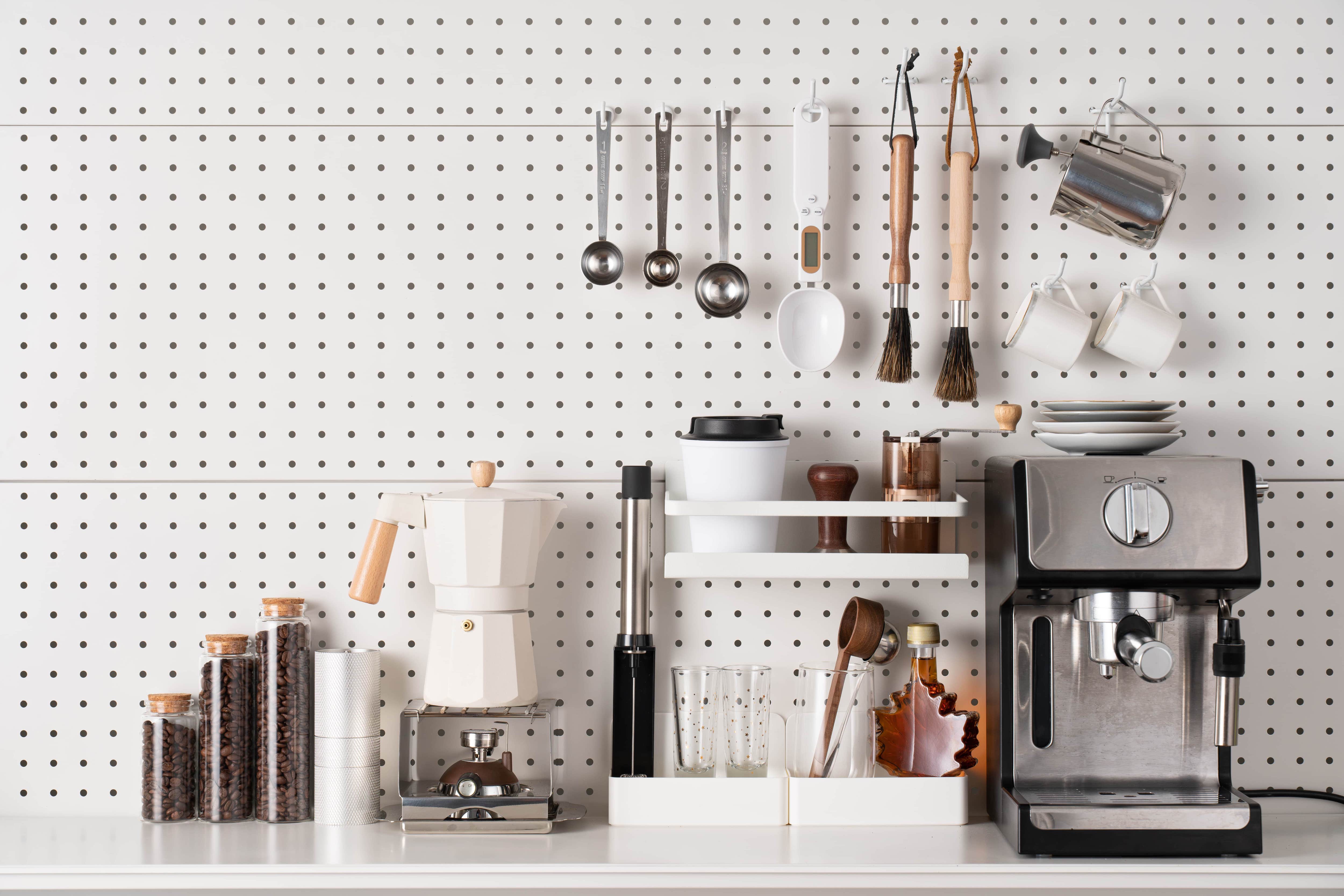Pegboard wall behind espresso station