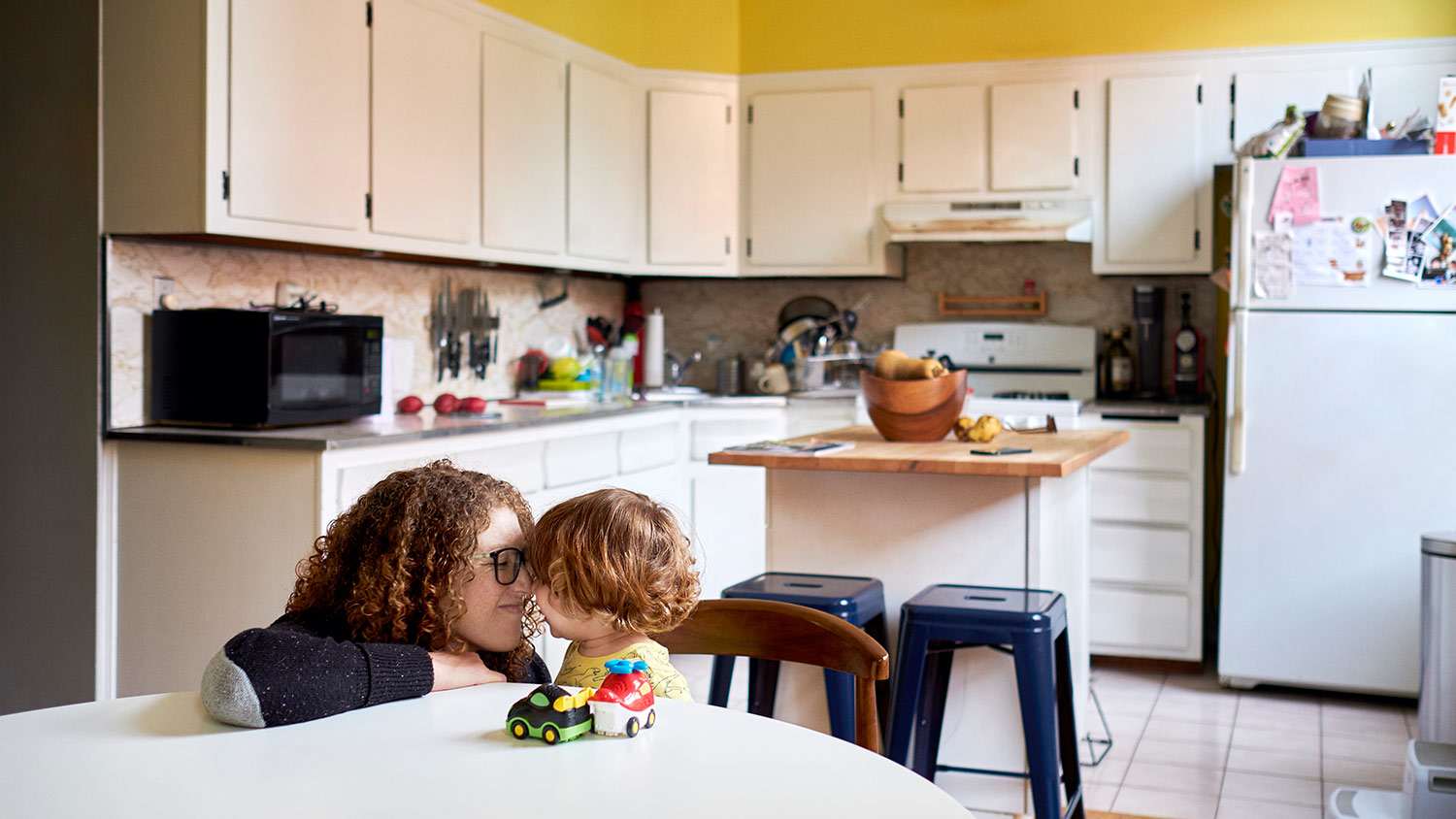 Mother and son play in kitchen