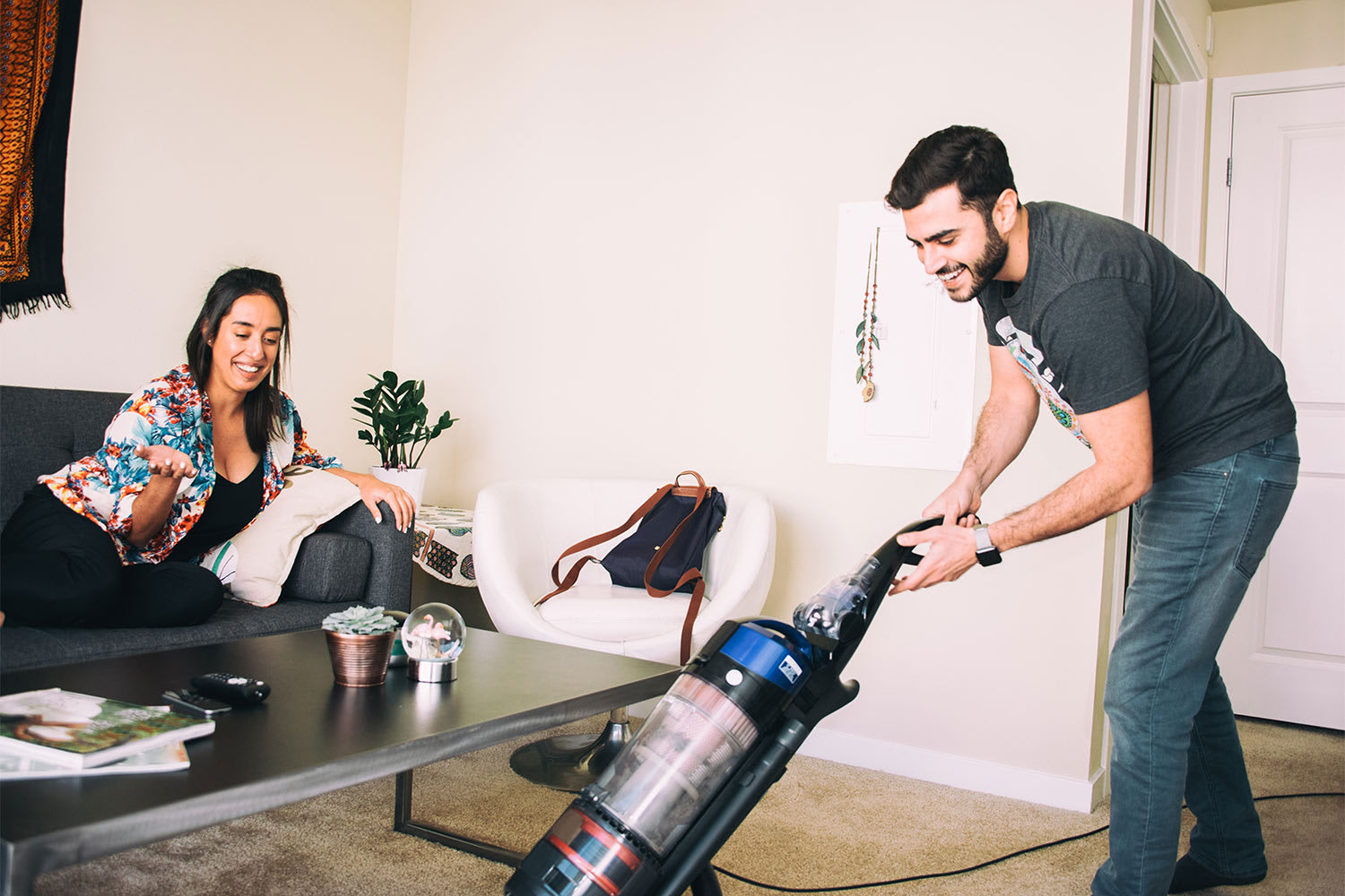 A woman cleaning carpet