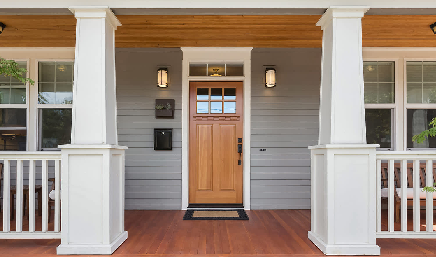 Front porch of home with stained door