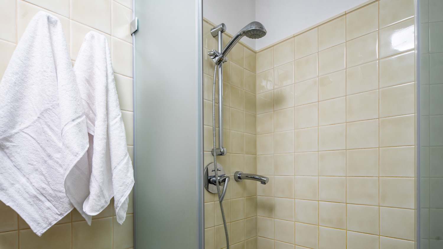 Towels hanging by the shower