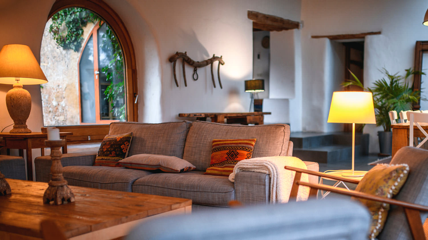 A bohemian living room with a comfy couch