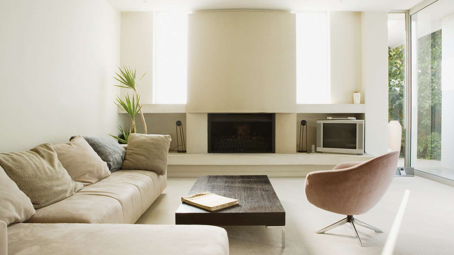 A minimal living room with a large fireplace