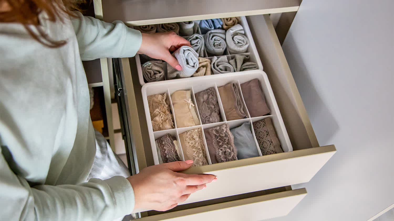 woman organizing drawer divider