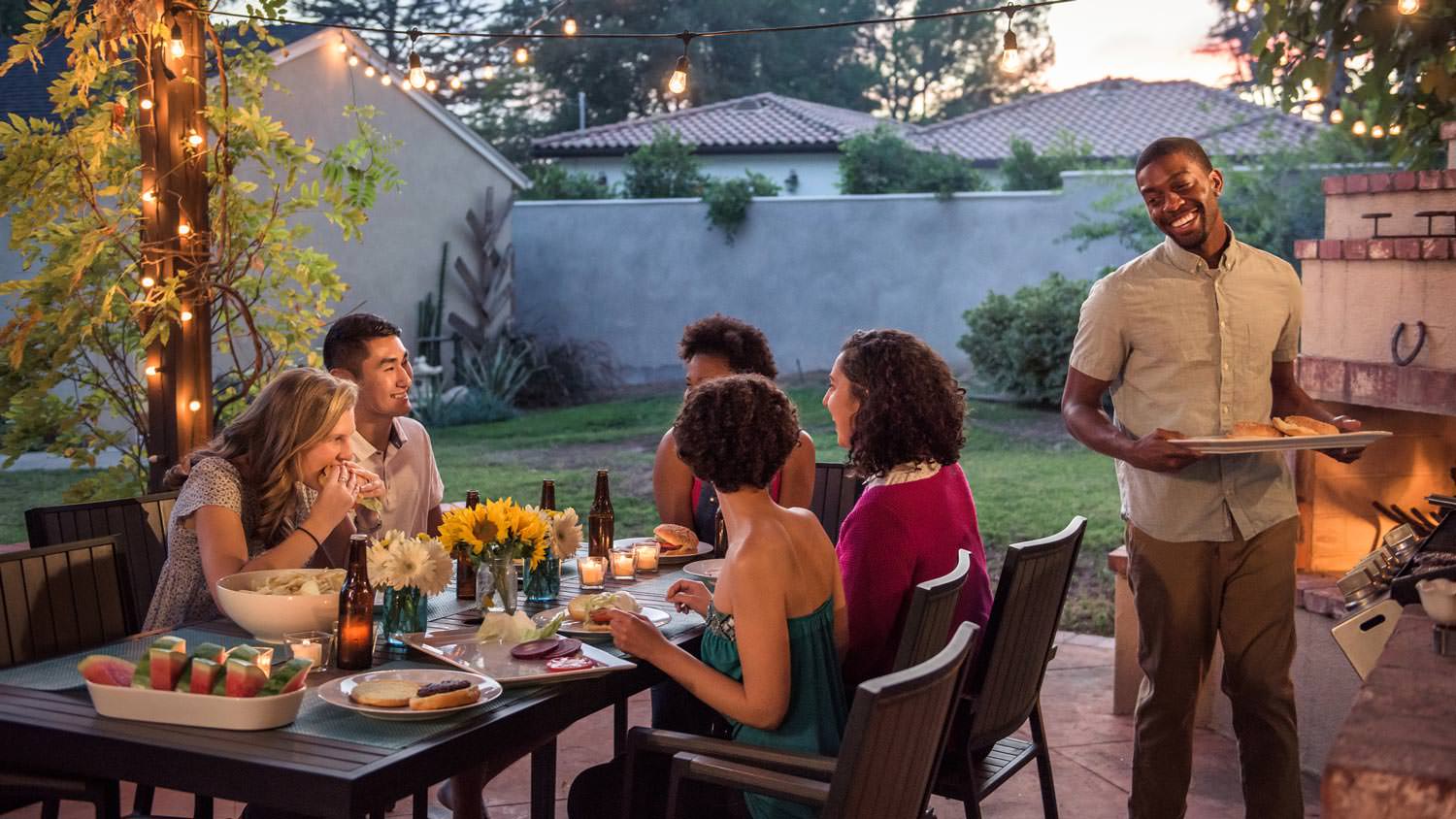 Friends having dinner at a house’s patio
