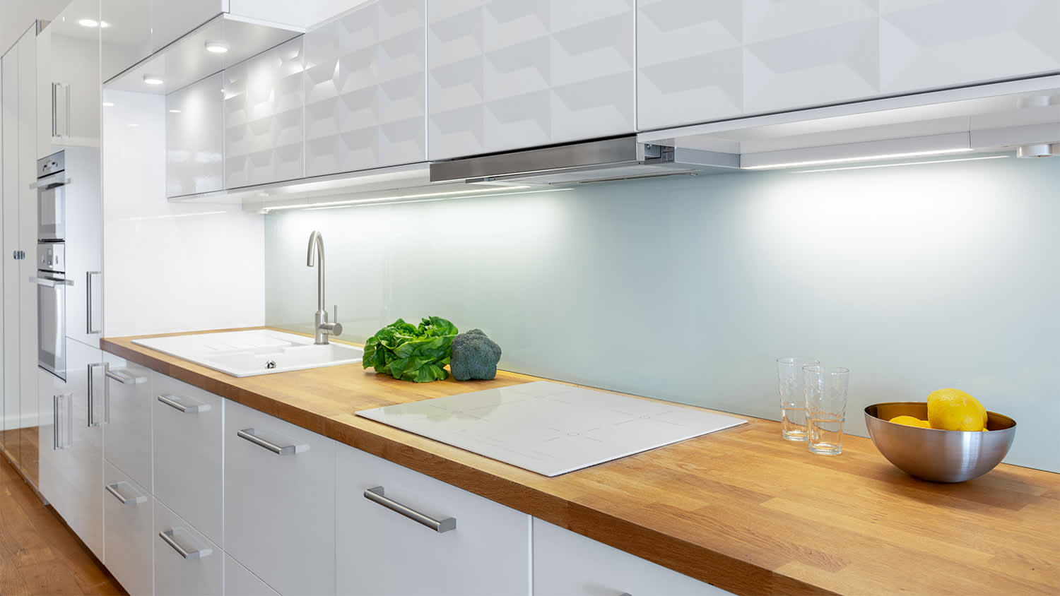 white kitchen with cabinet lighting