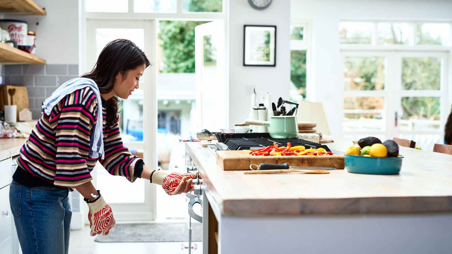 A woman prepping her lunch on a floating kitchen island