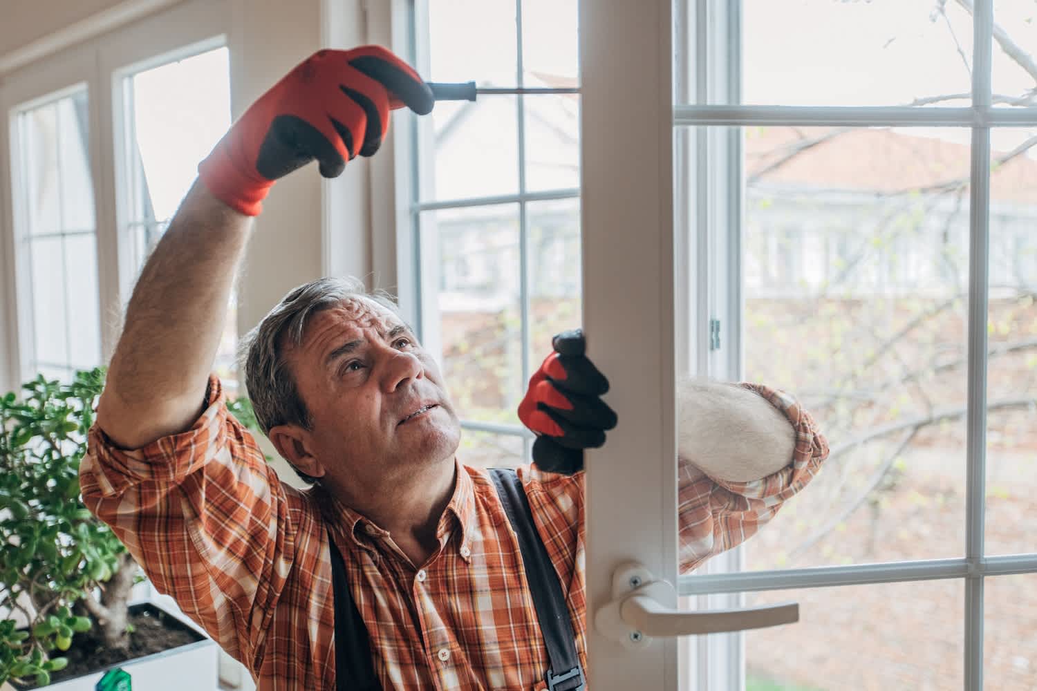 A worker installing a new window
