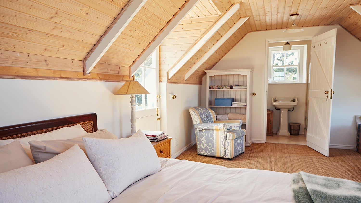 Spacious attic bedroom with bathroom in a home