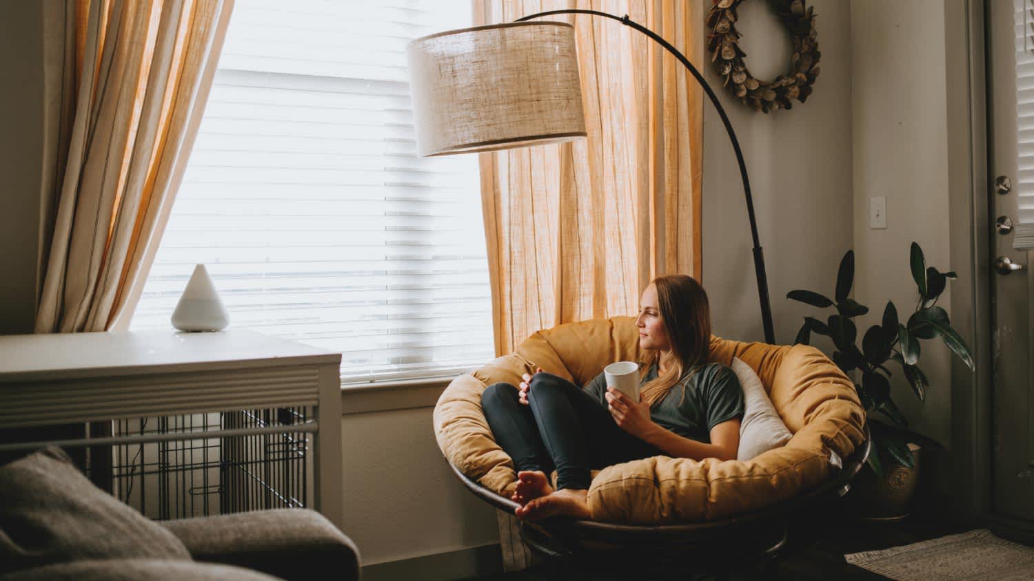 Woman relaxing at home with mug