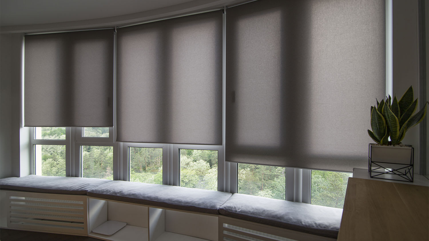 bedroom with motorized roller shades