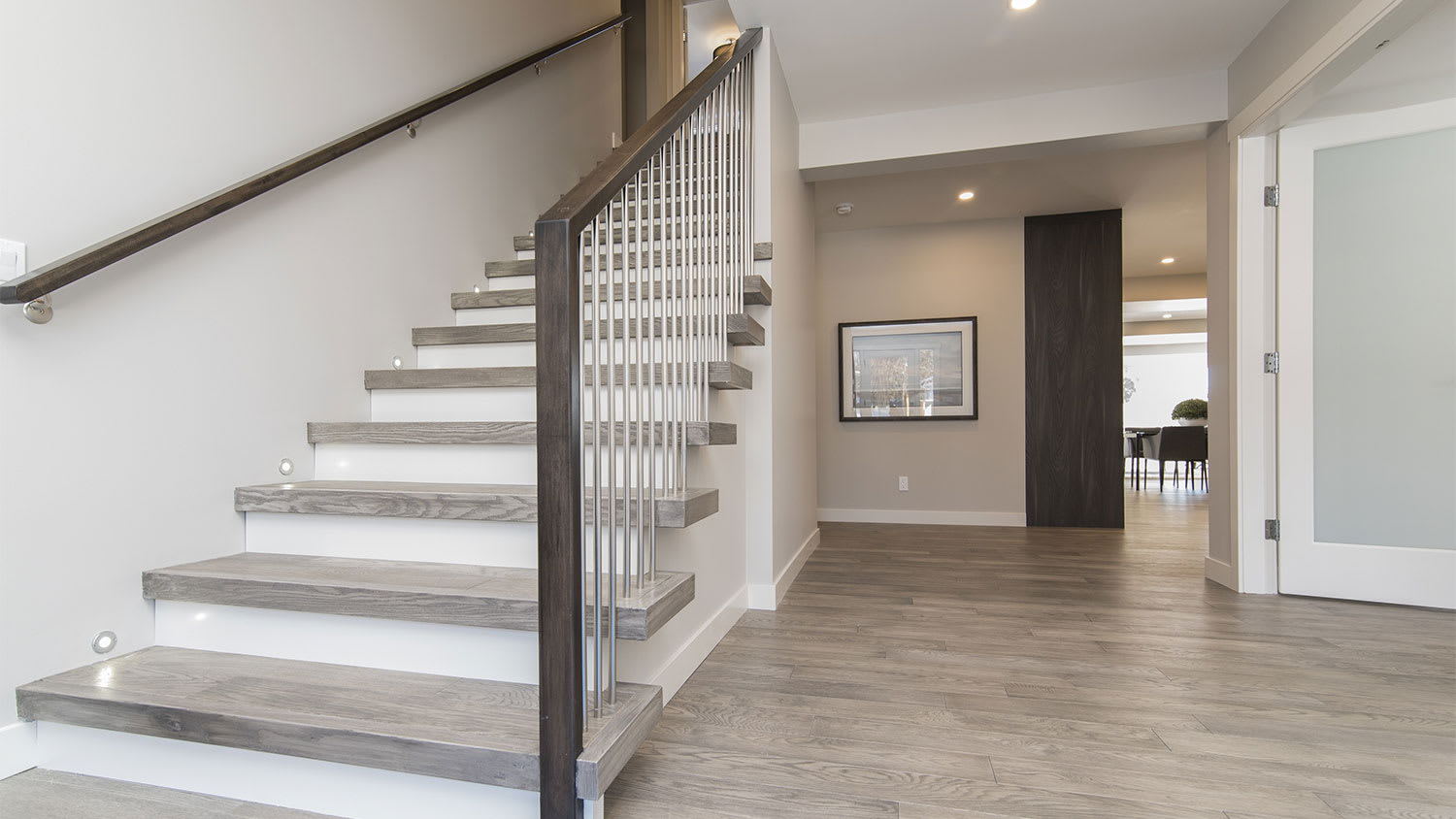 Home staircase with wooden railing
