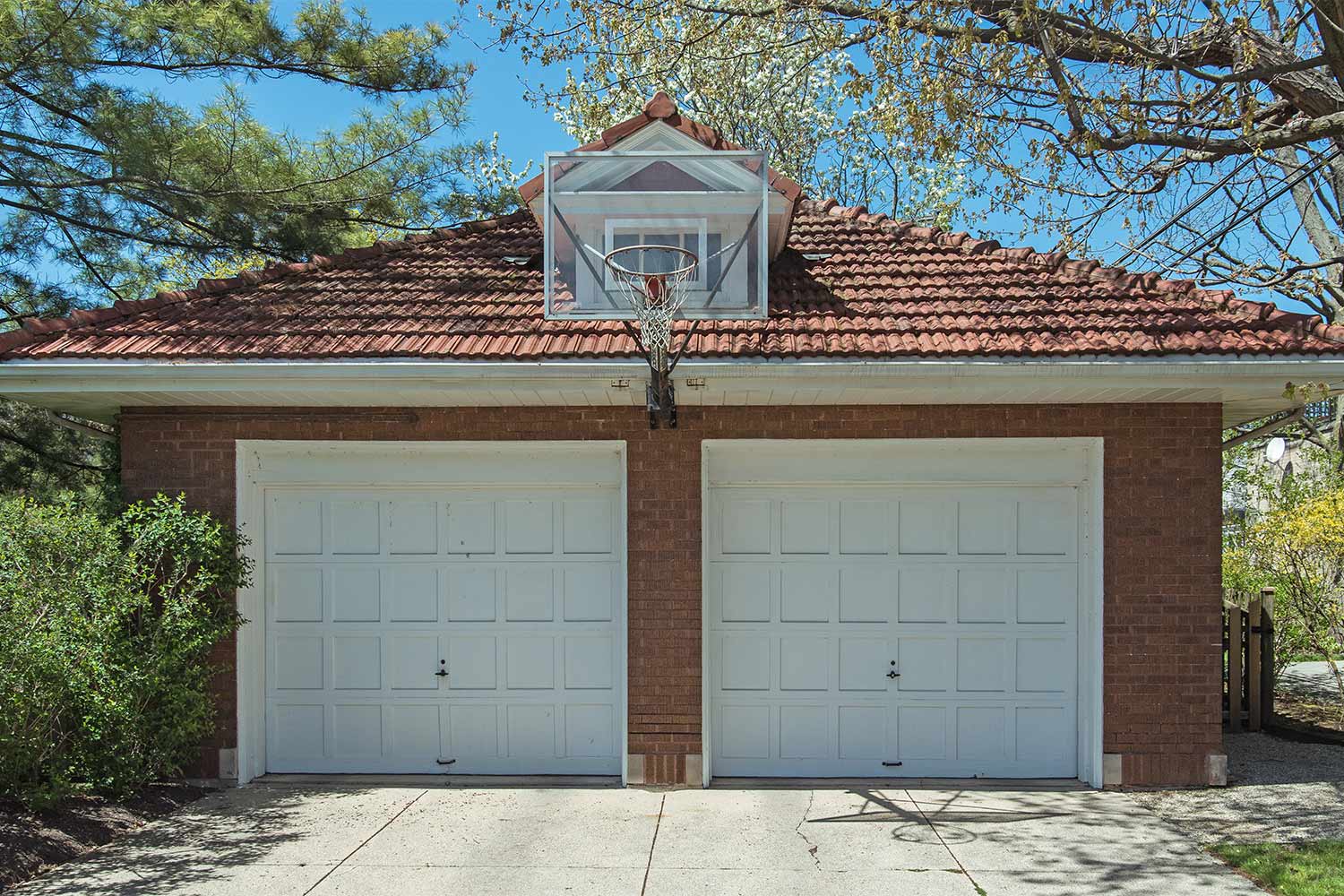 garage with mounted basketball hoop