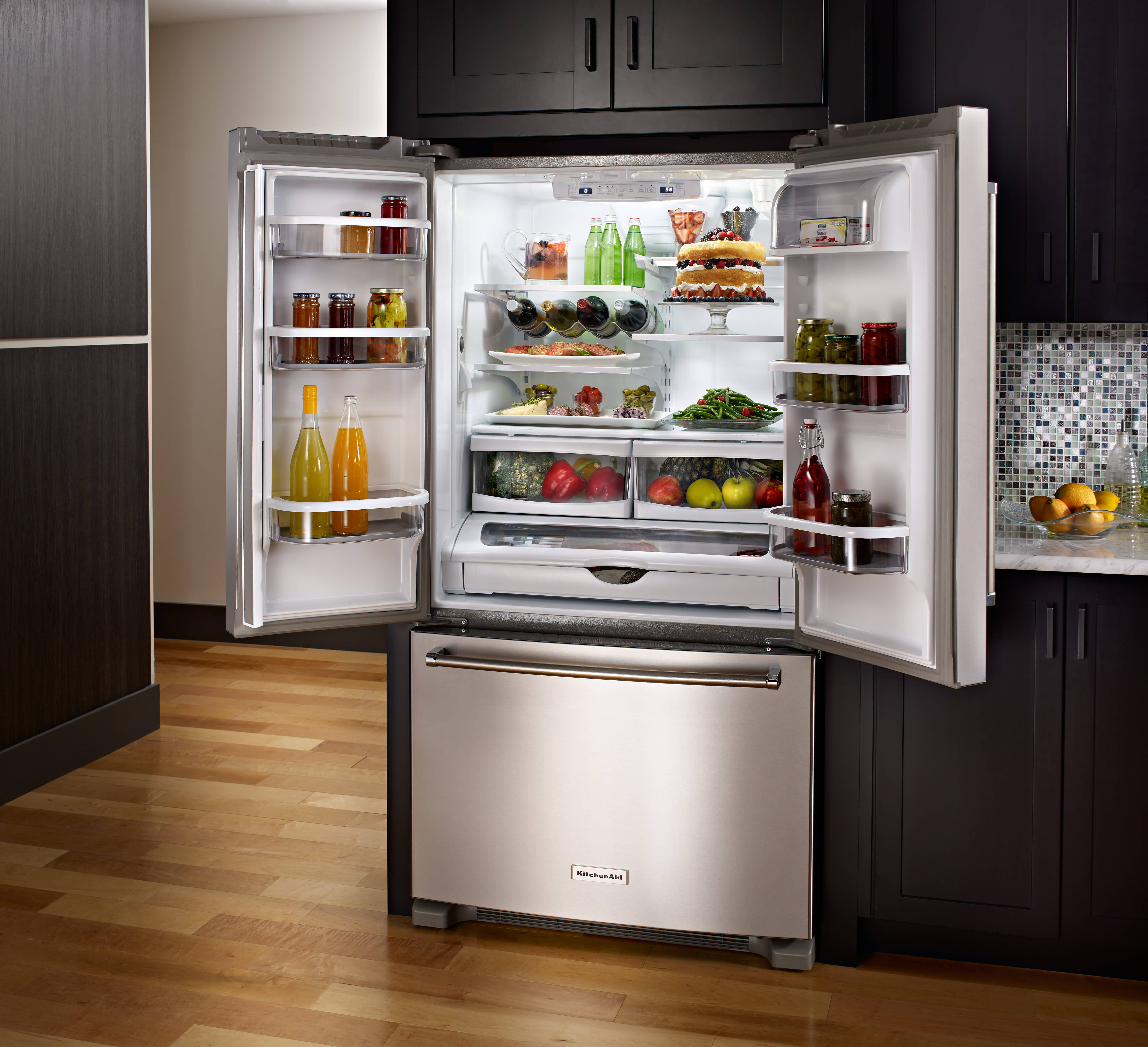 a silver refrigerator in a modern kitchen