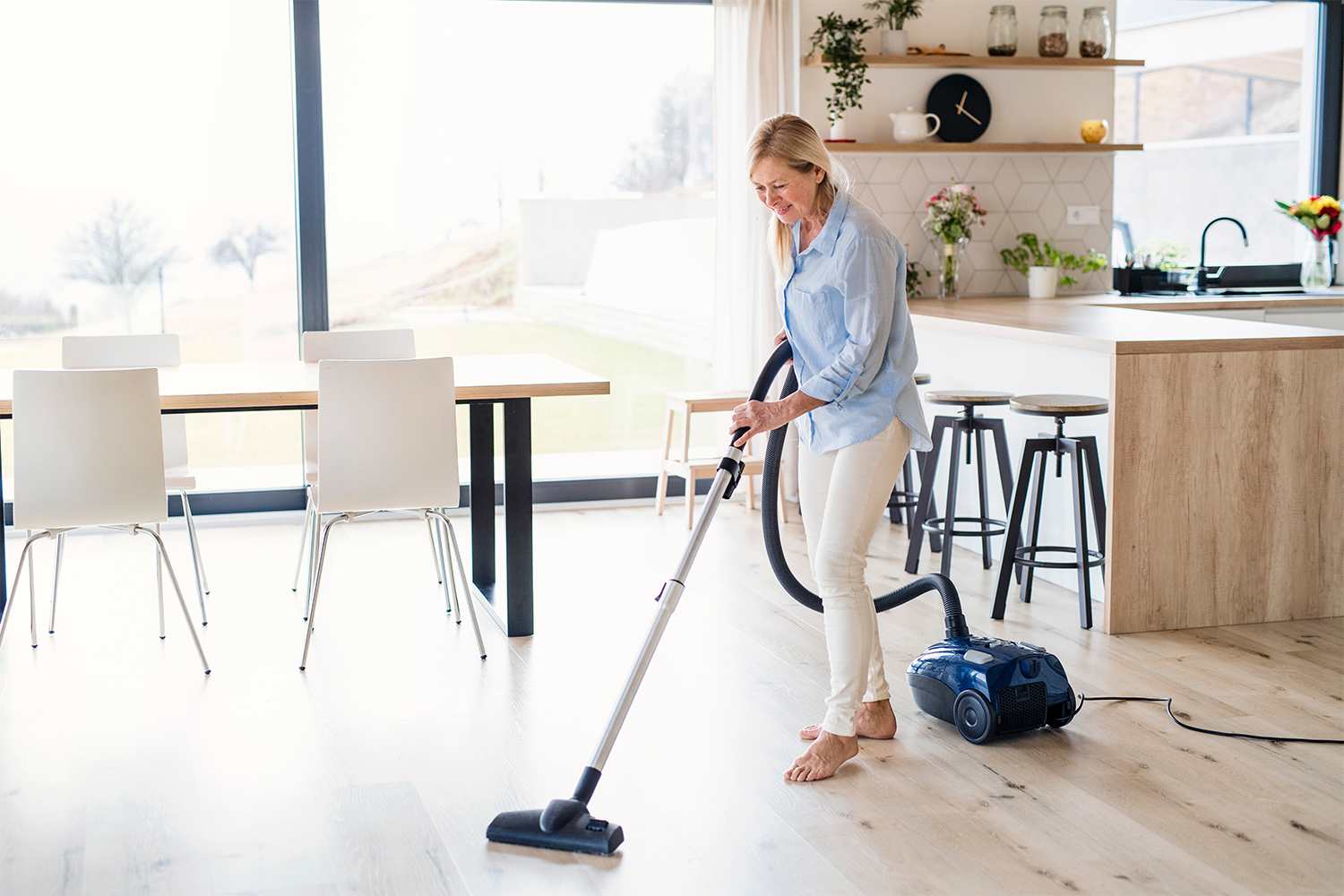A woman vacuuming at home