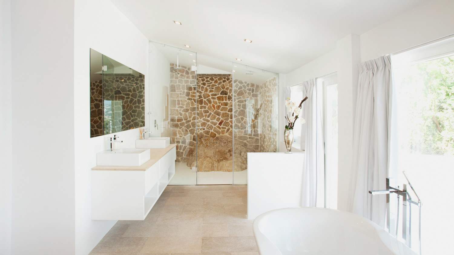 Two sinks and a bathtub in a modern bathroom