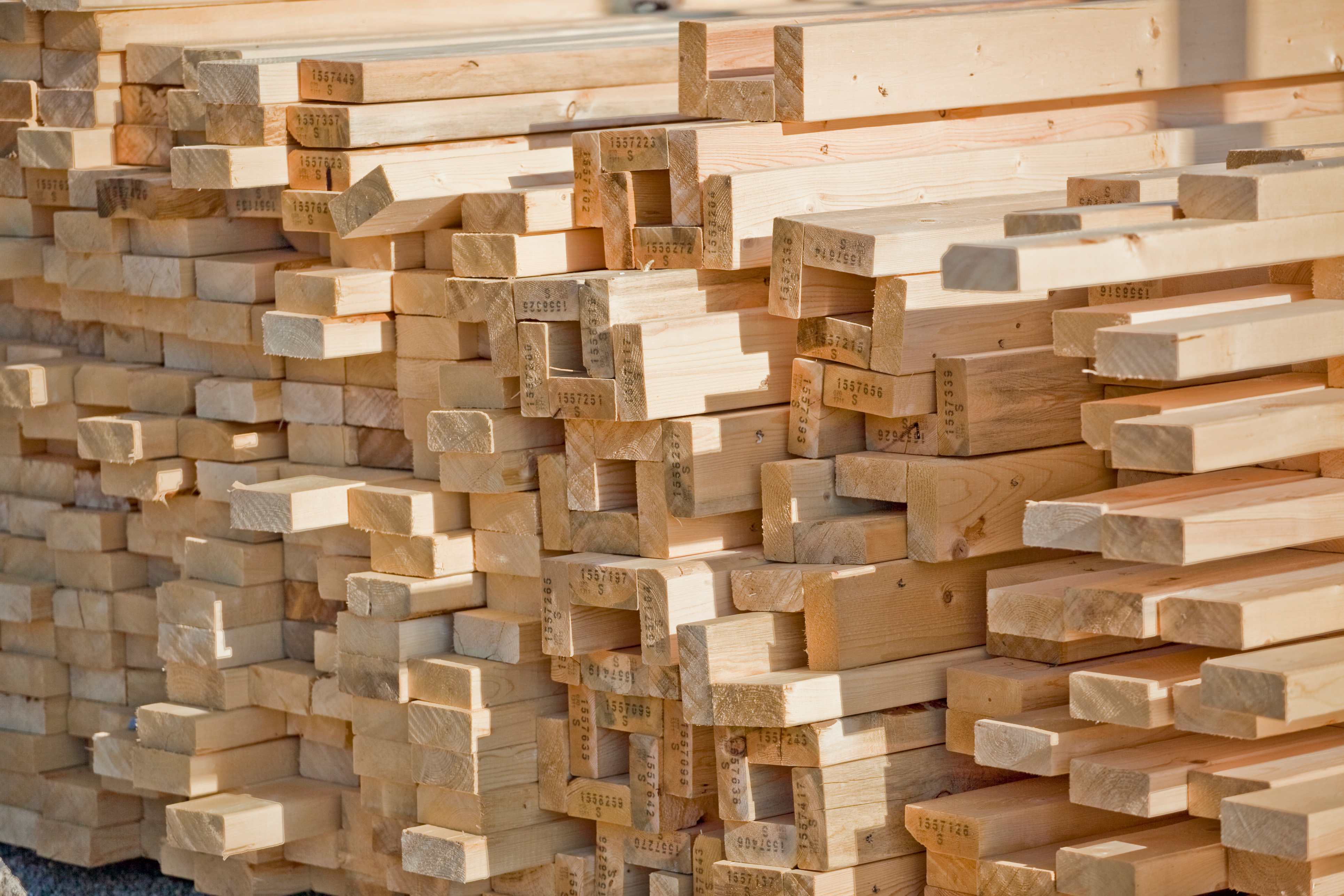 lumber stacked for home construction