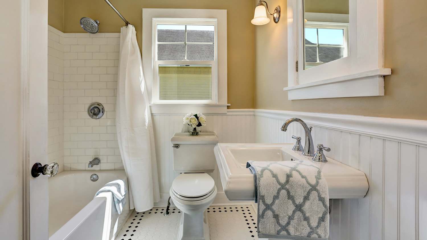 Full bathroom with white tile