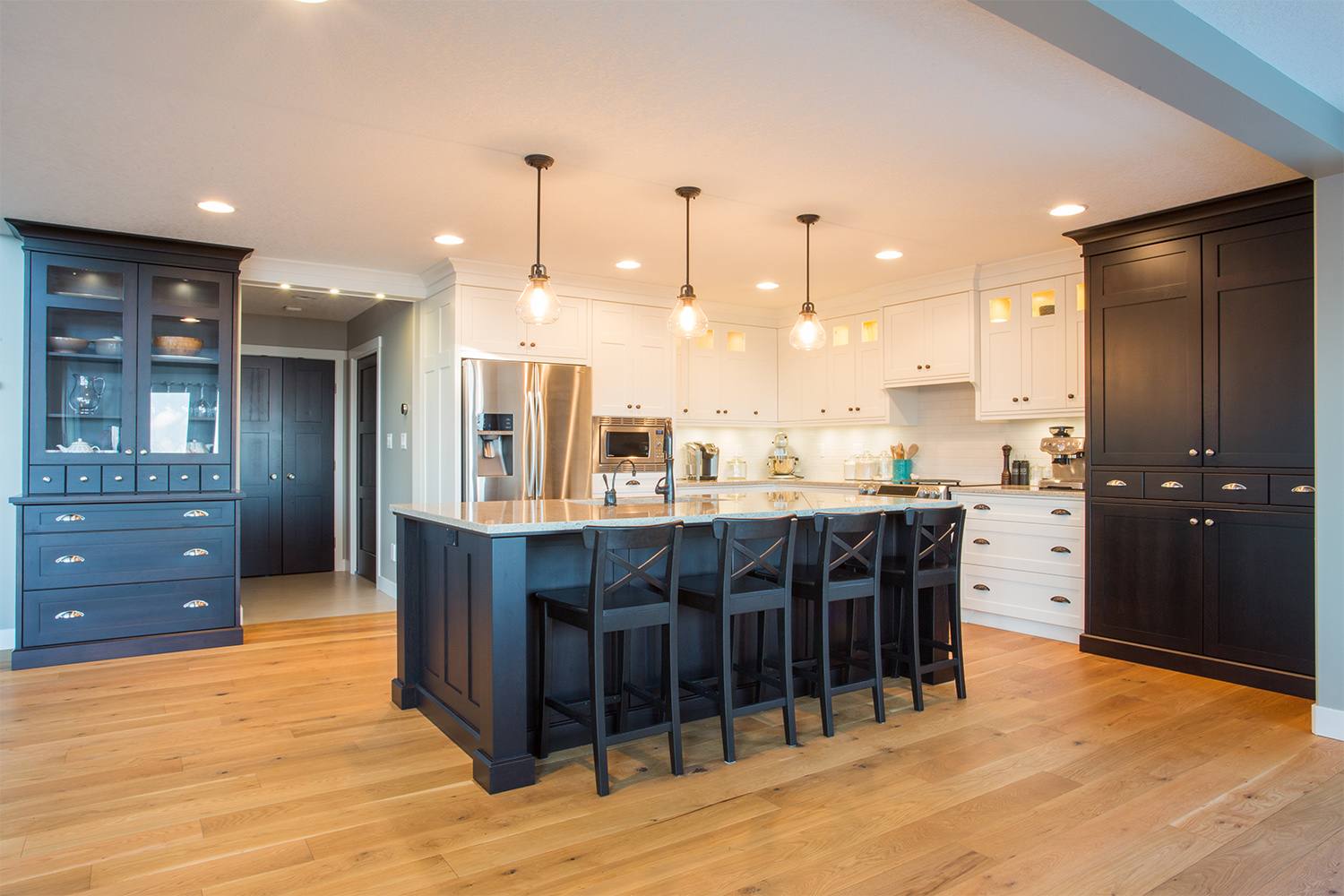 Light hardwood floors with contrasting cabinetry