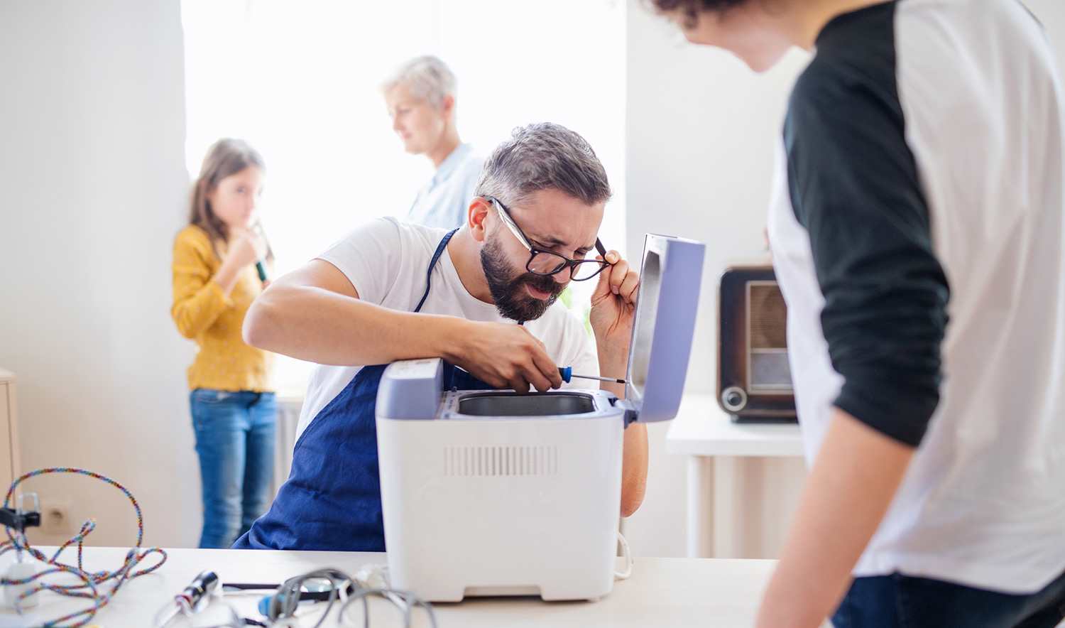 A professional repairing a small appliance