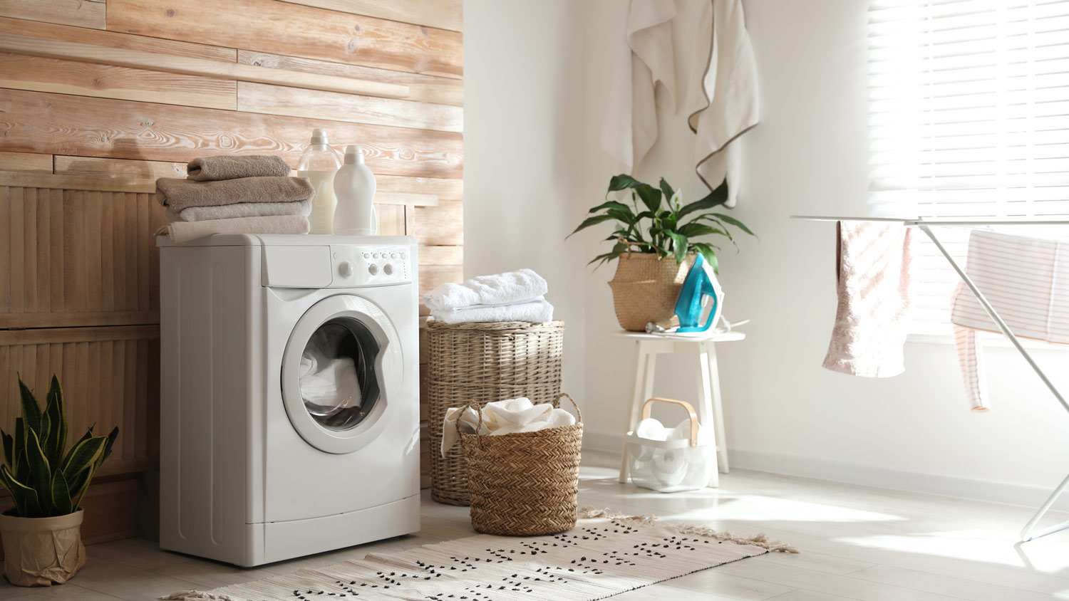 A tidy laundry room with a washing machine