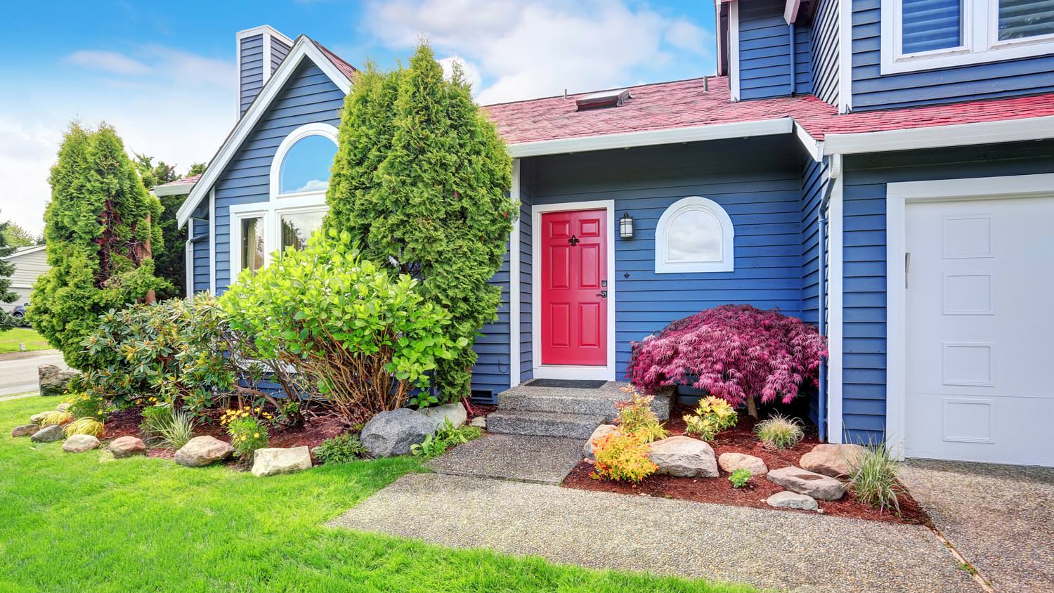 The exterior of a blue painted house