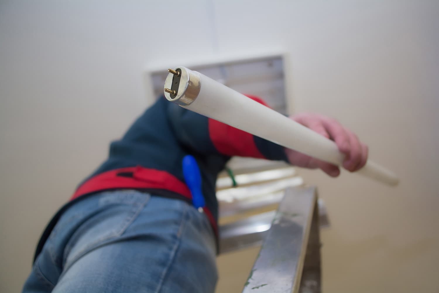 Man replacing light bulb