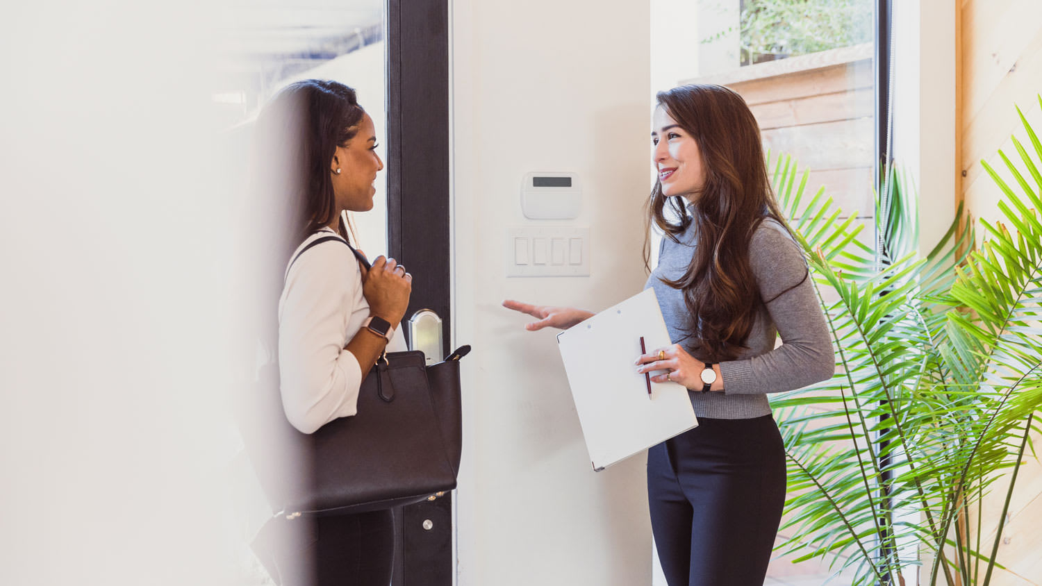 A homeowner discussing with a security provider
