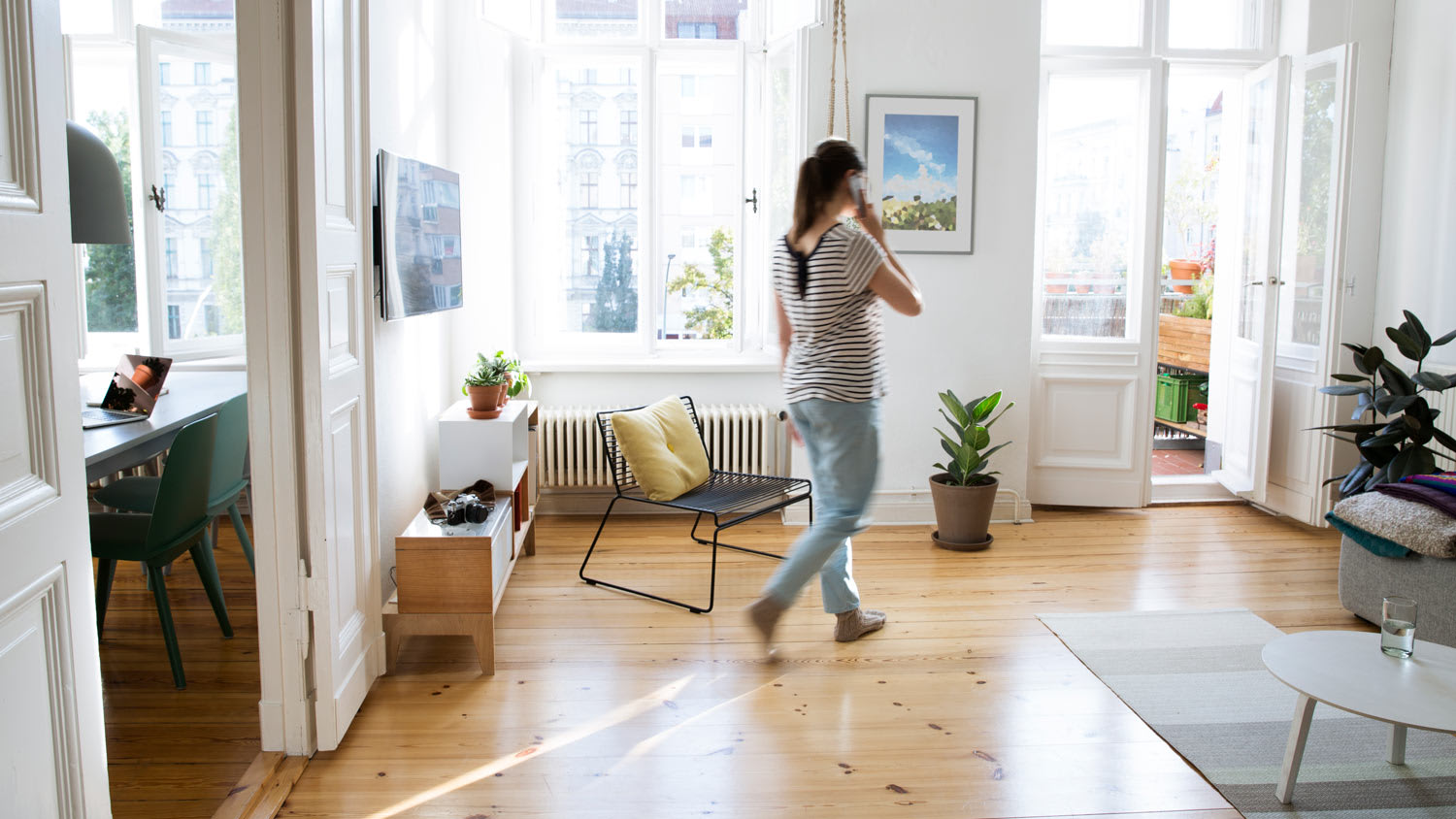 A woman walking across a room