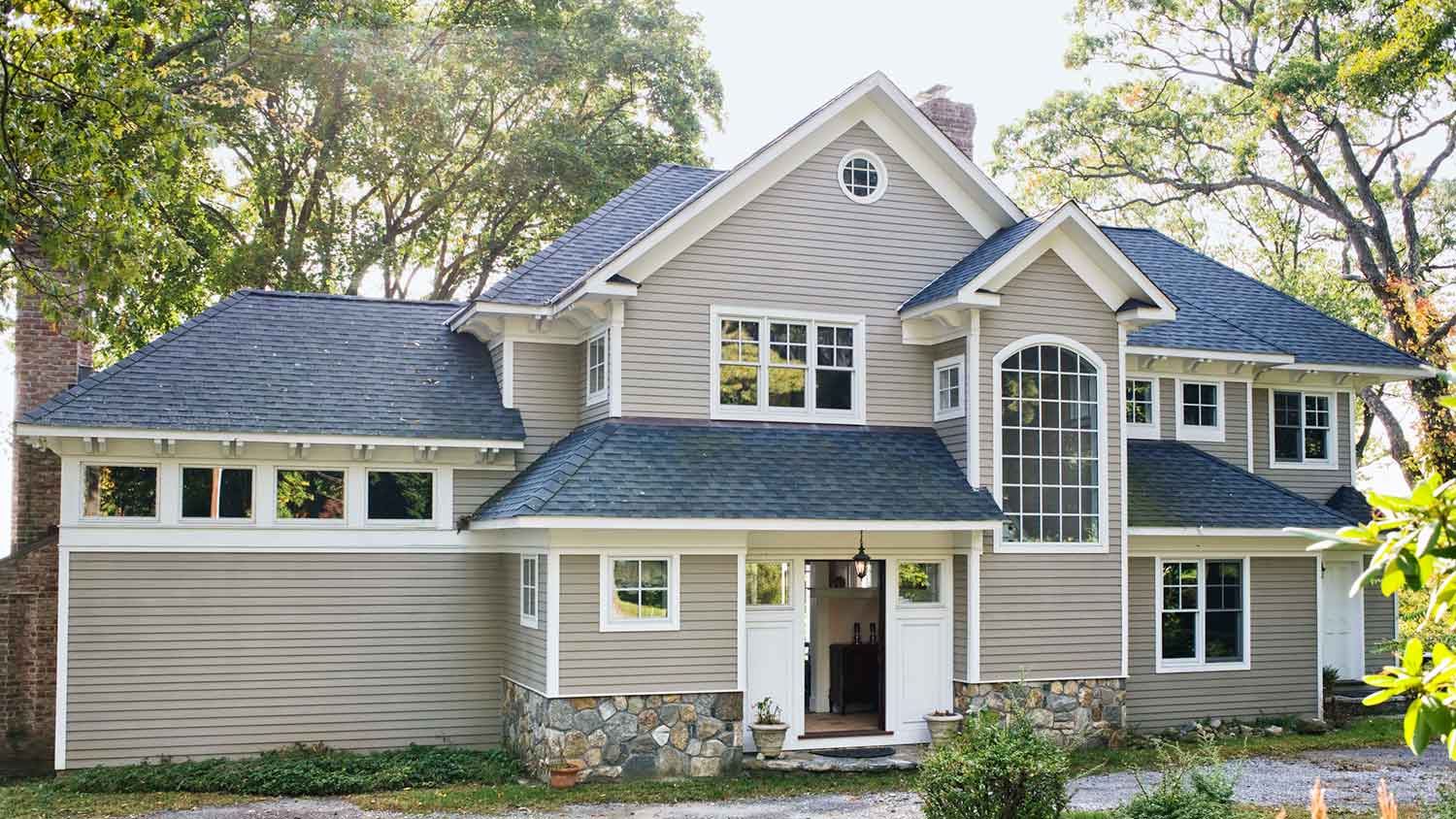 House exterior with vinyl siding and asphalt shingle roof