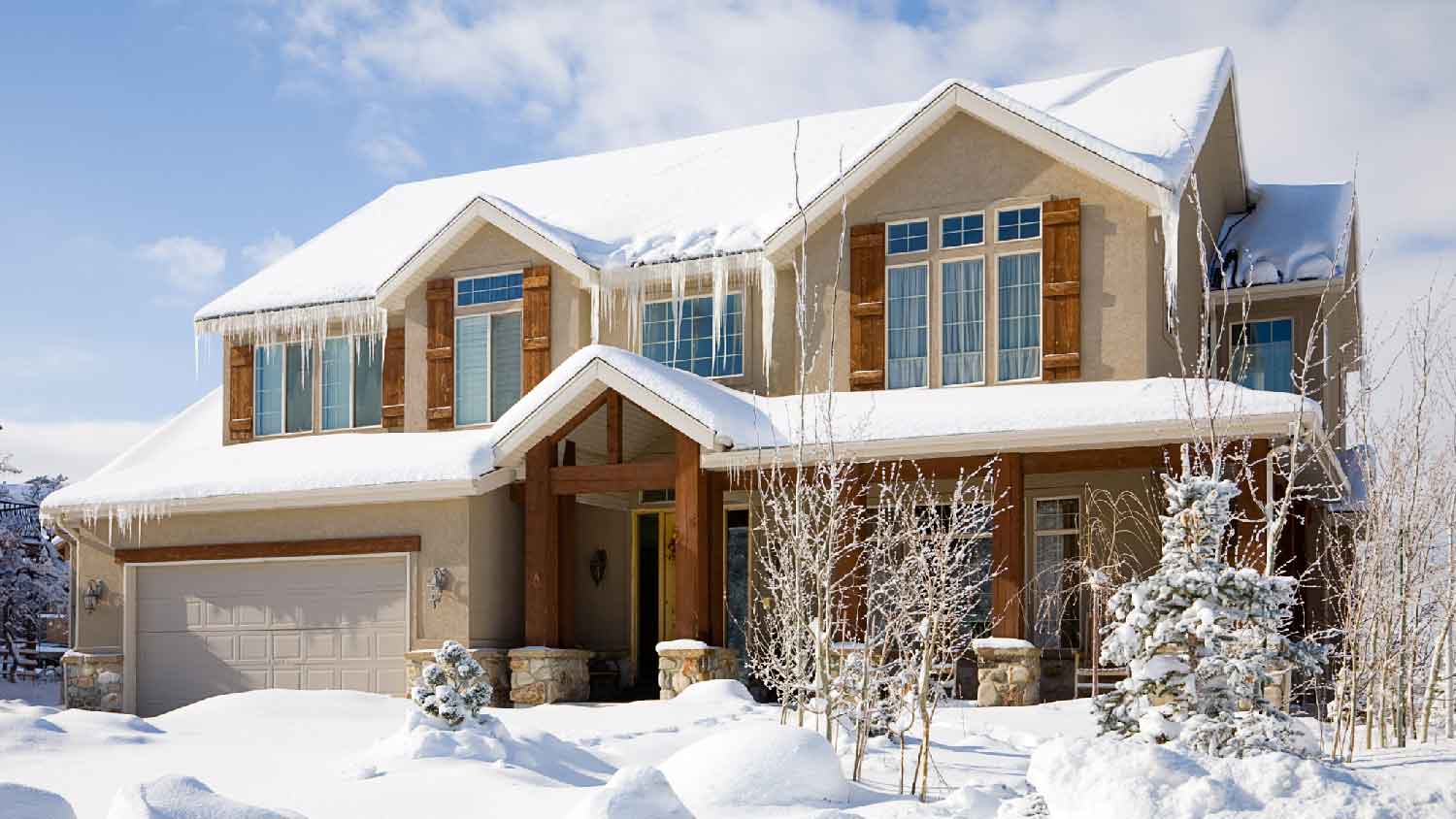 The exterior of a house covered in snow