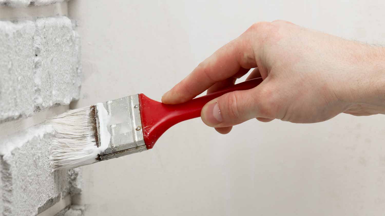 None Man painting bricks