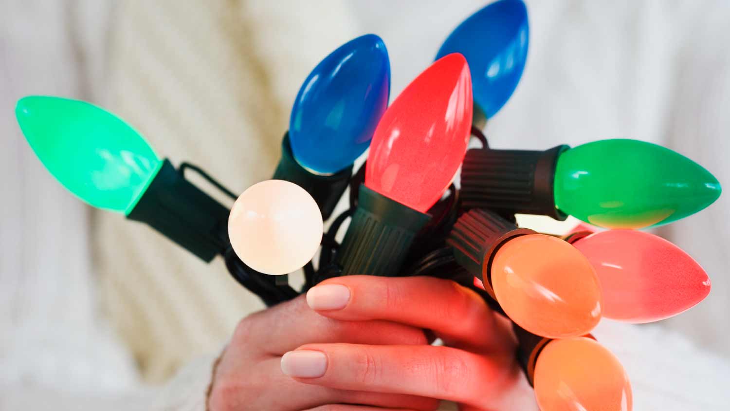 None Woman holding bunch of Christmas lights