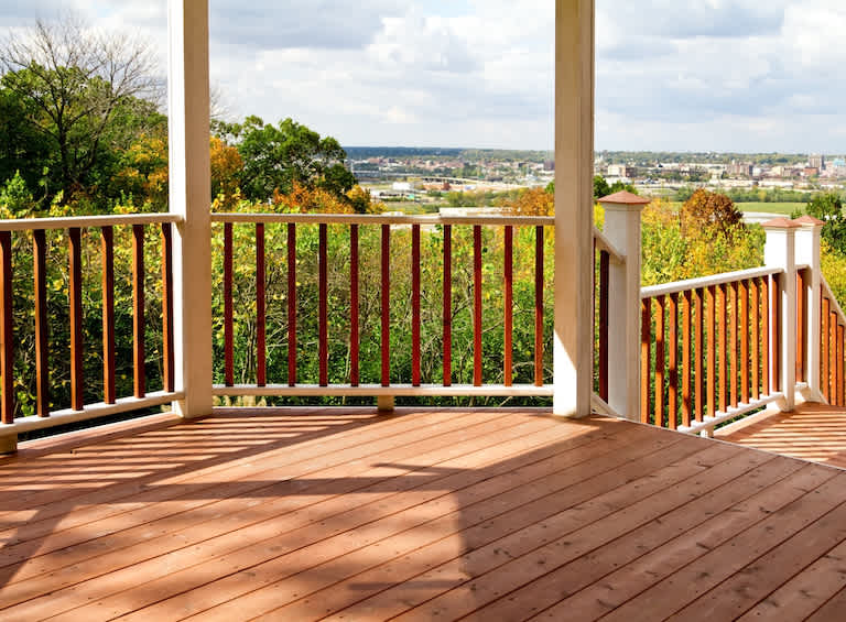 None a cedar deck overlooking the city in the distance