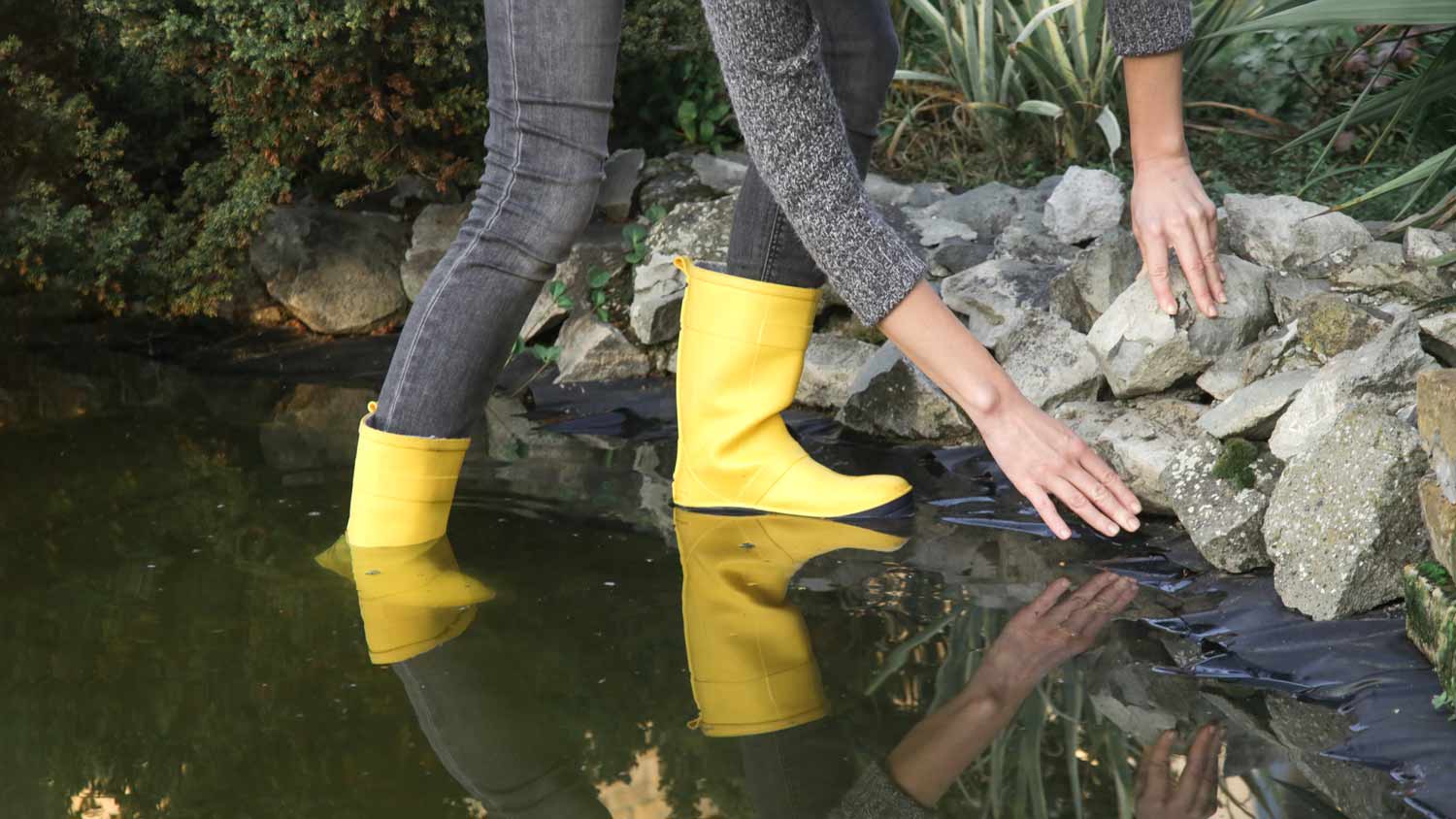 None woman checking garden pond