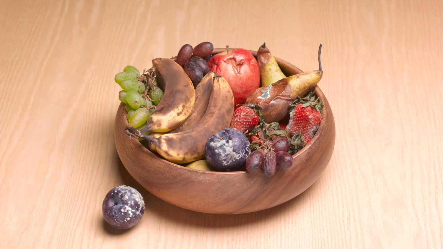 None Bowl of rotting fruit