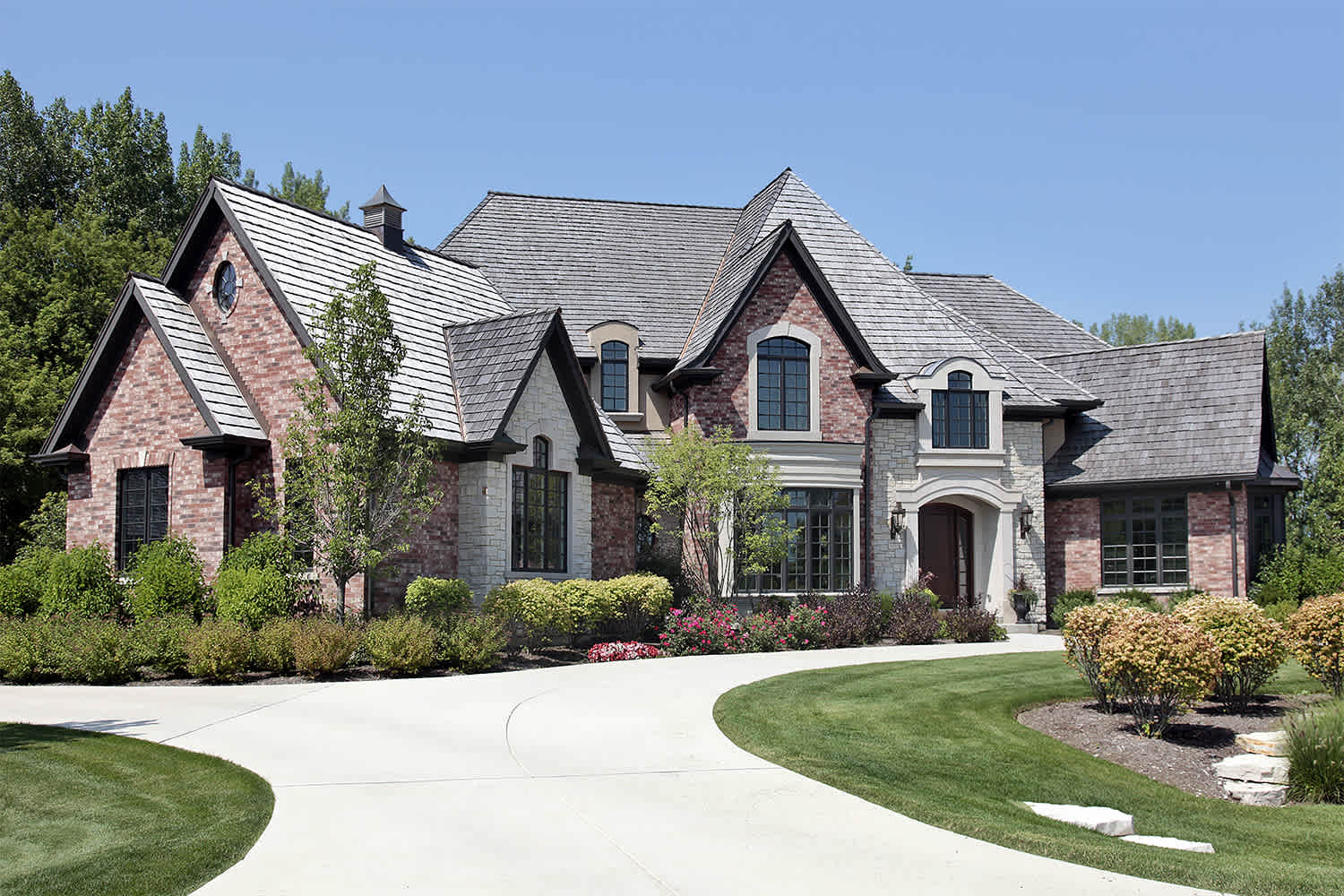 Contrasting stone and brick home