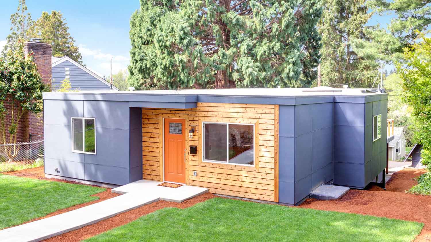 One story house with epdm roofing and wooden siding