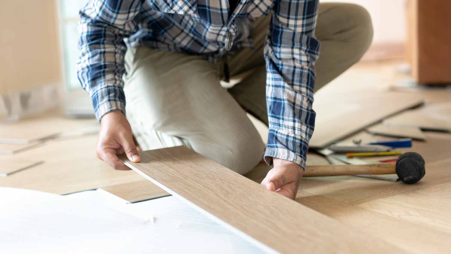 None Man installing parquet floor