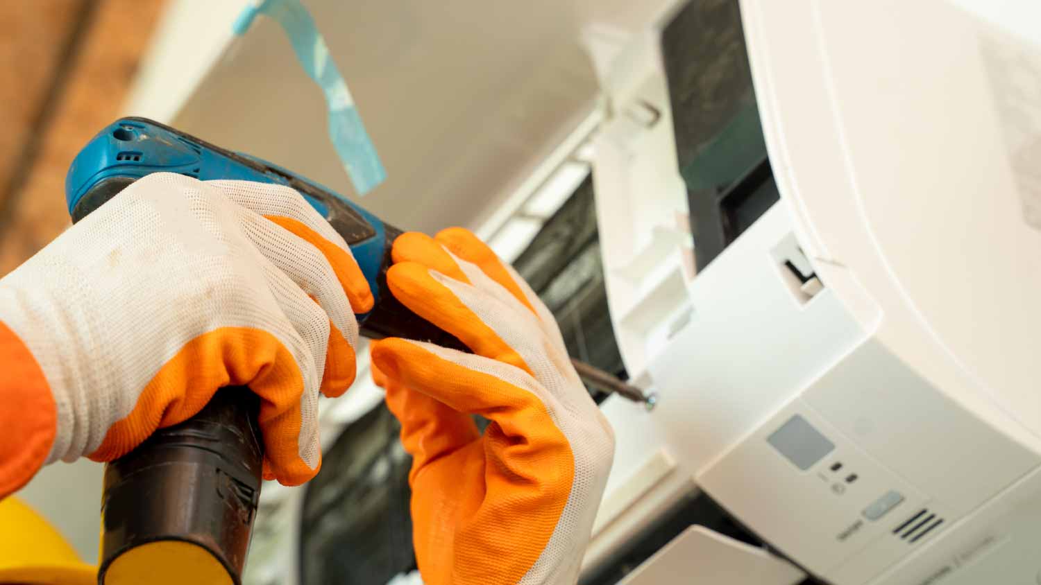 None Electrician installing air conditioner