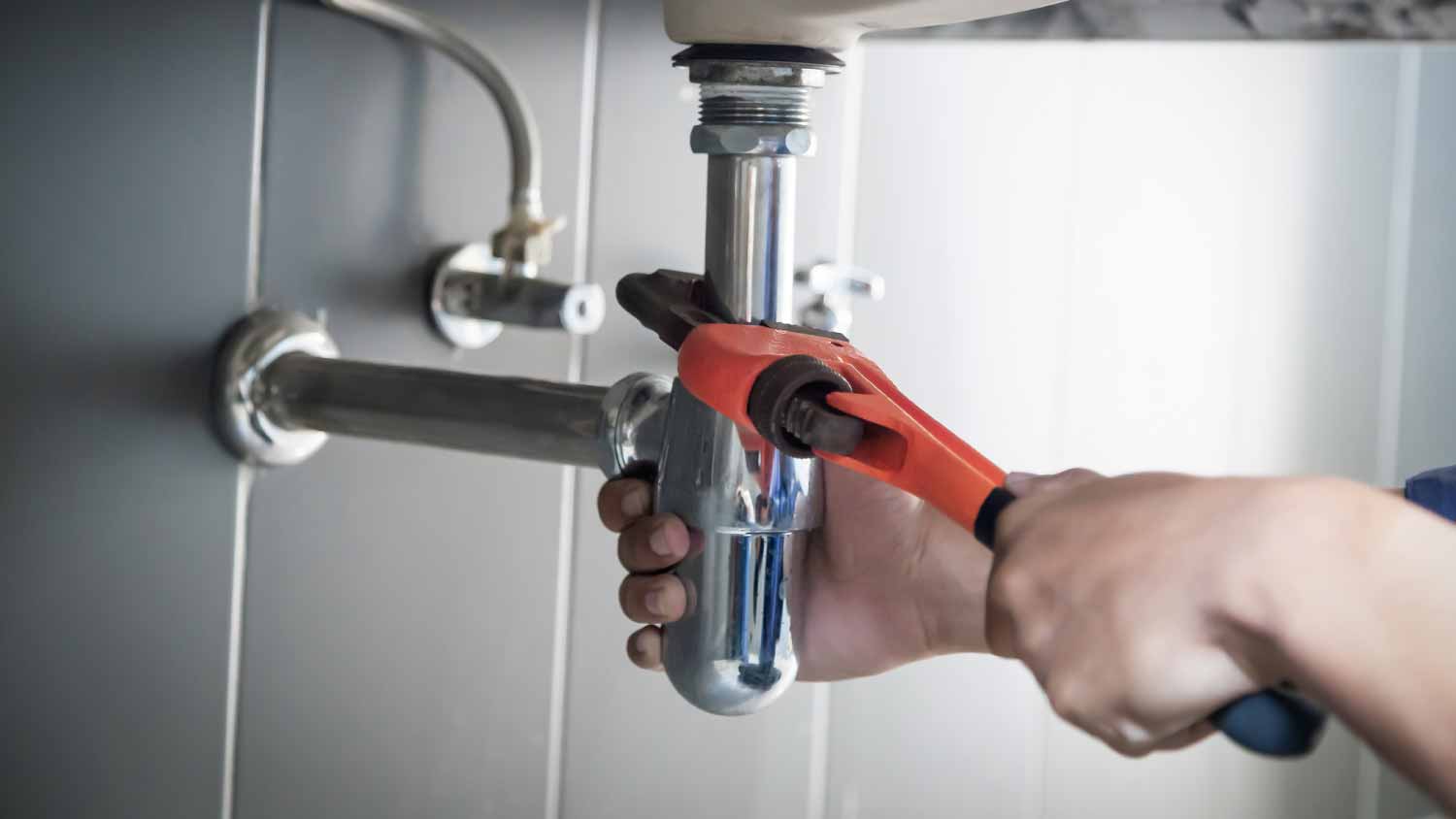 None Plumber fixing water leak