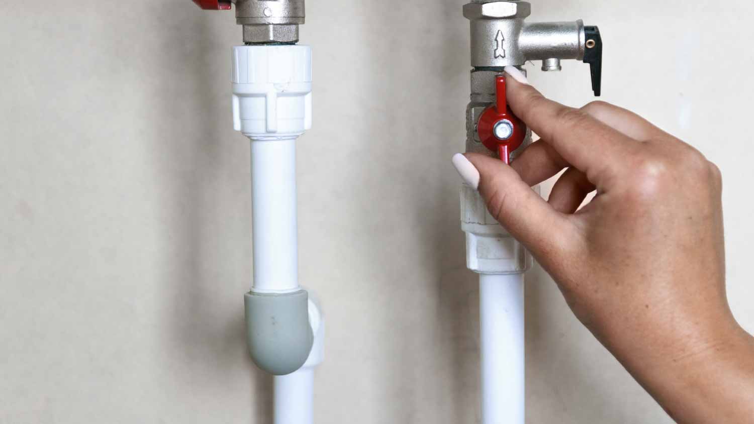 None Woman turning of water valve
