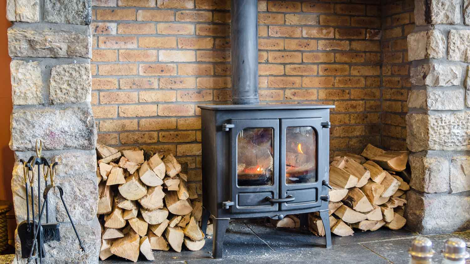 wood burning stove brick fireplace