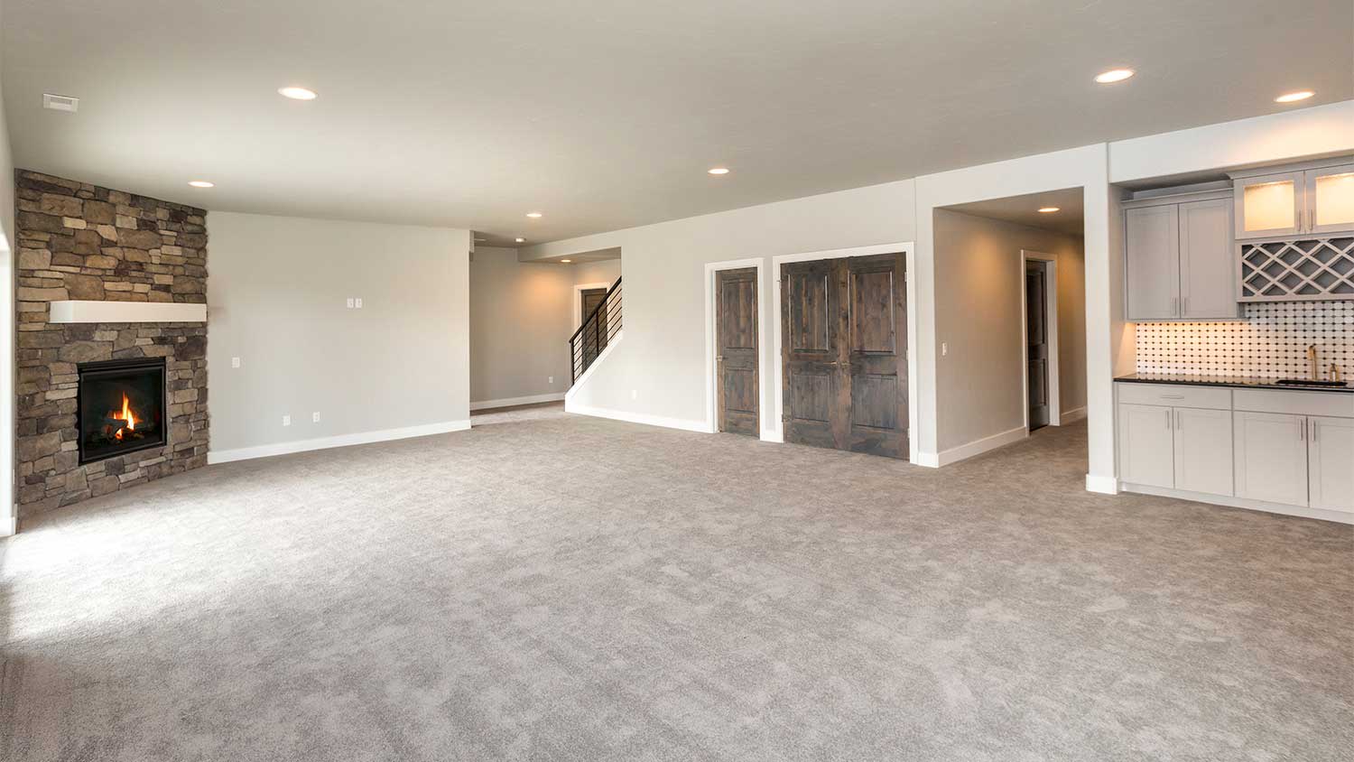 A view of a carpeted lower level of a house