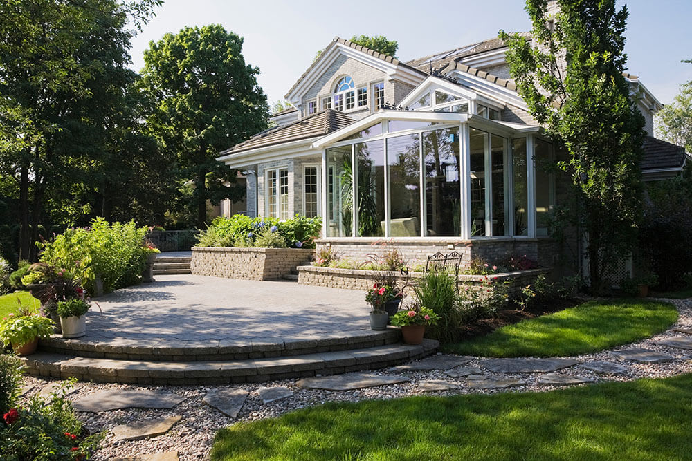 Beautiful home with stone patio and landscaping