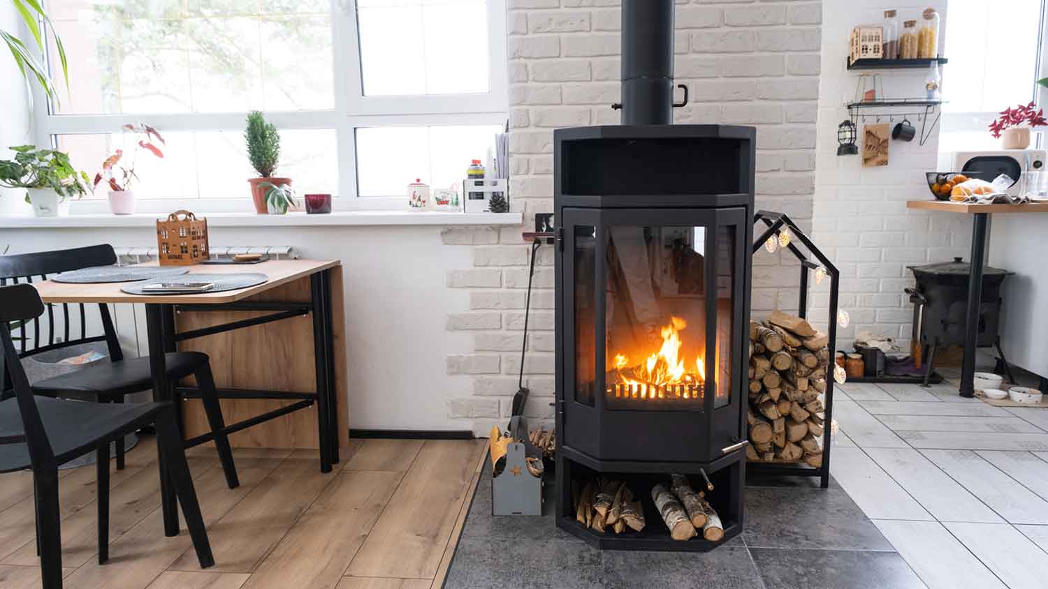 Wood stove with fire burning installed in the house