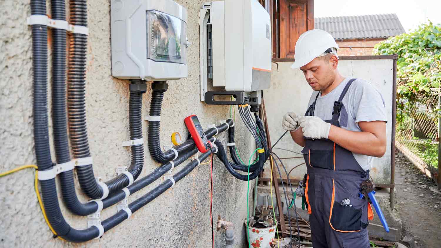 None electrician wiring electric box outside home